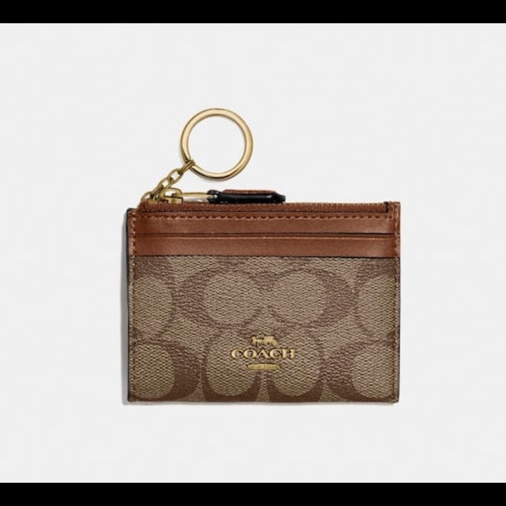 - Coach
Mini Skinny Id Case In Signature Canvas
COLOR: GOLD/KHAKI S…